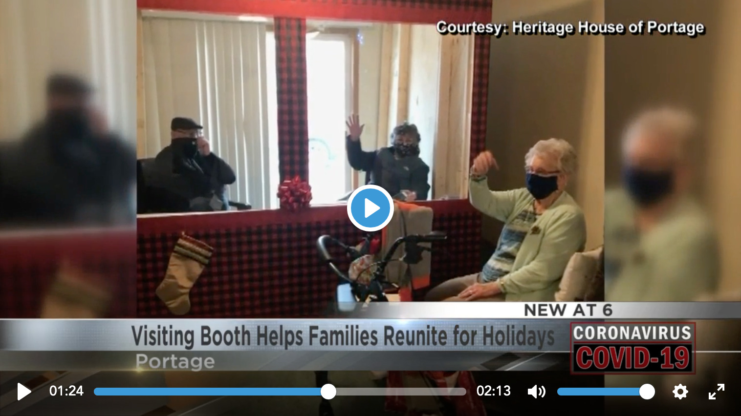 Video thumbnail of Senior resident visiting with a family members who are sitting in the Visiting Booth