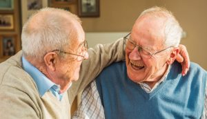 Heritage House Assisted Living Two friends enjoying a chat in a senior living community